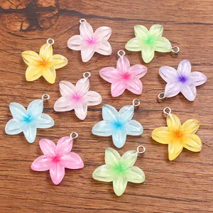 Colorful resin 5-petal flower charms with jump rings for DIY jewelry making and crafts.