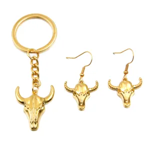 Gold stainless steel bull skull keychain and matching earrings set, perfect western jewelry.