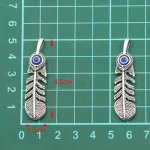 Detail view of 48x12mm evil eye feather pendant charm, zinc alloy DIY jewelry making.