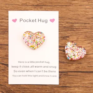 Colorful resin heart pocket hug token with glitter flakes for love gift and holiday present.