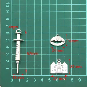Medical theme DIY metal charms pendants, syringe and hospital designs for creative crafts.
