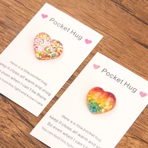 Pocket hug resin heart token with cute backing card, perfect romantic gift and love keepsake.
