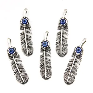 12x48mm DIY zinc alloy hollow feather pendant charms with blue evil eye resin patches for jewelry making.