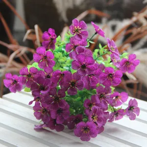 Artificial flower bouquet purple violet faux floral arrangement home decor detail shot