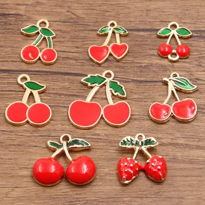 Various styles of alloy enamel fruit cherry and strawberry charm pendants for DIY jewelry making.