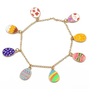 Gliederarmband in Goldoptik mit bunten Emaillierten Ostereier Anhängern für DIY Schmuck.