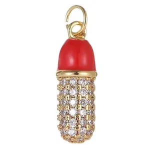 Exquisite 14K gold plated capsule pendant charm with vibrant enamel and sparkling cubic zirconia.