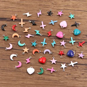 Close-up detail shot of colorful enamel heart, star, moon and lightning charms for DIY jewelry.