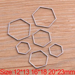 Cadres géométriques hexagonaux en acier inoxydable pour la fabrication de bijoux DIY et accessoires.