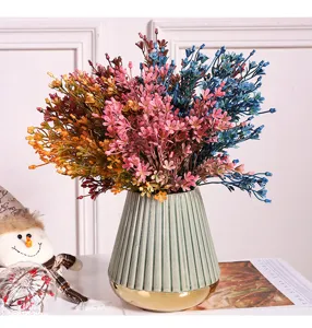 Artificial flower bouquet with ceramic vase, colorful glass grass for home office decor.