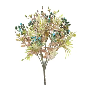 Artificial plastic flower bouquet with palm leaves and berries for home room decor.