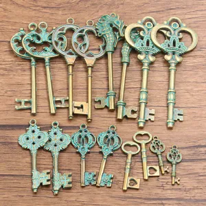 Vintage bronze patina key pendants set, antique brass alloy hollow keys for DIY crafts.