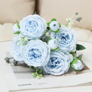 Close-up of light blue artificial peony bouquet, exquisite silk flower details for home decor.