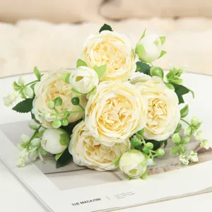 Delicate artificial peony and rose flower bouquet close-up, perfect for home and wedding decor.