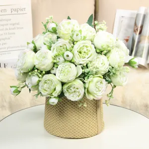 Artificial peony rose flower bouquet in woven vase, beautiful table home decor for wedding.