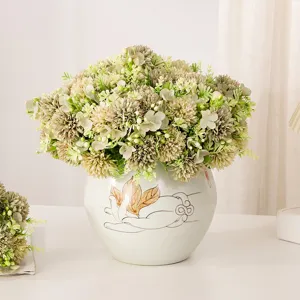 Detail view of artificial pompon chrysanthemum bouquet in ceramic vase, autumn decor home ornament.