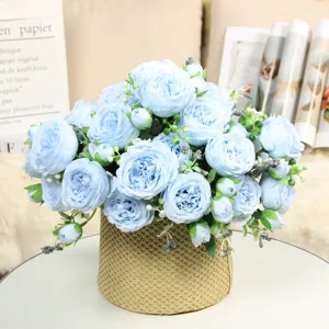 Beautiful light blue artificial peony rose flower bouquet in woven pot for home decor wedding.