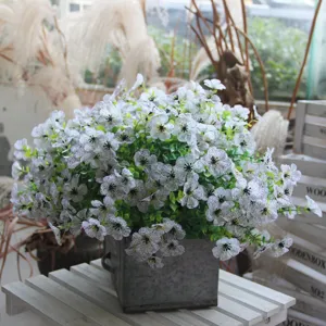 Artificial violet flower bouquet for home decor, realistic faux floral arrangement in metal pot.