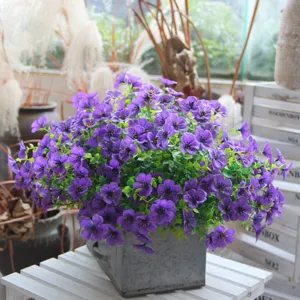 Detailed shot of artificial violet potted plant, vibrant purple flower bouquet for home decor.