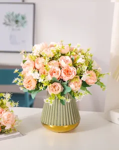Artificial peony flower bouquet with ceramic vase for elegant home decor and wedding arrangement.