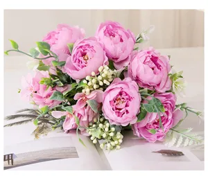 Detail shot of pink artificial peony bouquet, realistic handmade floral arrangement for home.
