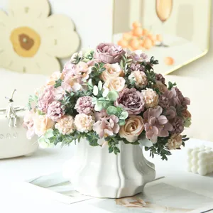 Artificial rose and peony flower bouquet detail, home wedding decorative floral arrangement.