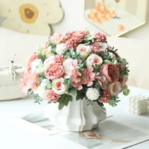 Artificial rose peony flower bouquet in white vase for home wedding decor setup