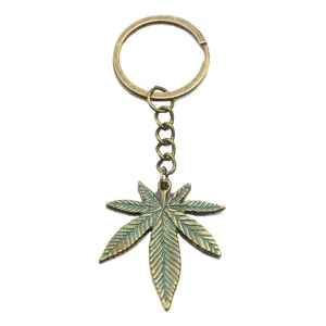 Vintage bronze alloy leaf keychain retro plant charm pendant accessory for diy crafting.