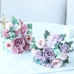 Artificial silk rose and hydrangea flower bouquet detail view for home wedding decor.