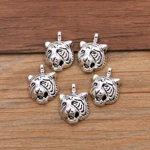 Silver tiger head charms pendants for DIY jewelry making, necklace bracelet accessories crafts.