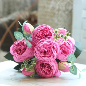 Detailed view of artificial pink peony rose flower bouquet close up for home decor.