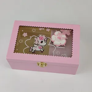 Pink wooden music box detail, cute unicorn pattern, transparent window, mechanical windup.