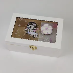 White wooden jewelry music box with clear window, cute anime unicorn charm and floral insert.