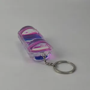 Detail view of a creative dual color liquid motion bubbler keychain with clear acrylic case.