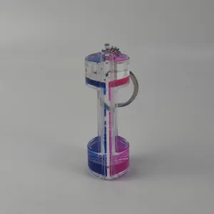 Detailed close-up view of the creative two-color liquid motion acrylic keychain pendant.