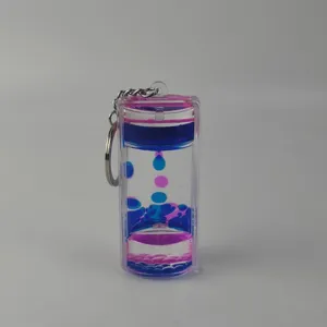 Detail shot of the dual-color liquid motion bubbler keychain with clear acrylic container.
