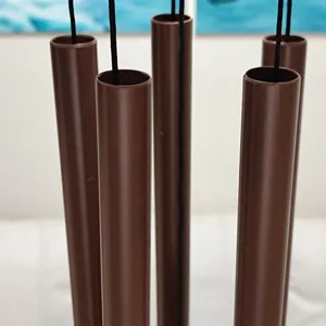 Metal wind chime detail close-up, 5 brown aluminum tubes, garden patio home decor accessory.