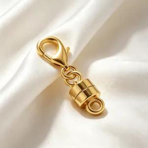 Gold magnetic clasp and lobster clasp detail for DIY jewelry making and necklace extensions.