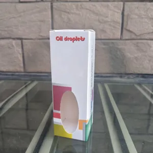 Detaillierte Ansicht der bunten Öltropfen Sanduhr Verpackungsschachtel mit Sichtfenster.