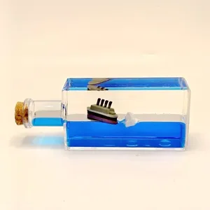 Unsinkable Titanic cruise ship fluid drift bottle, liquid wave desktop ornament and creative gift.