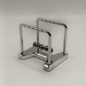 Detail view of double tier metal newtons cradle stress relief office desk toy ornament