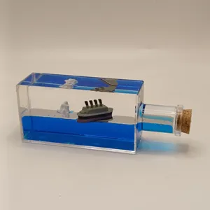 Detail view of the unsinkable cruise ship fluid drift bottle, showcasing clear acrylic structure.