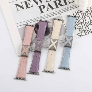 Detailed view of litchi grain leather watch straps with metal X buckle for smartwatches.