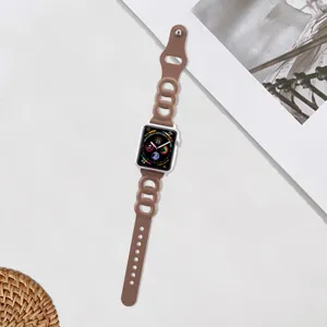 Replacement brown leather strap with unique three-ring design for Apple Watch series.
