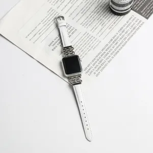 White leather Apple Watch strap with metal Chinese knot design, elegant replacement band.