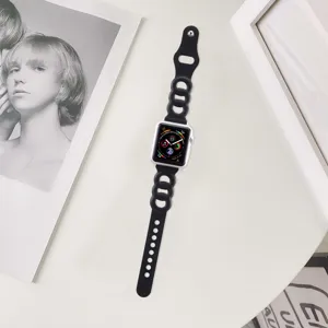 Detail shot of black cutout watch strap with minimalist background and elegant frames.