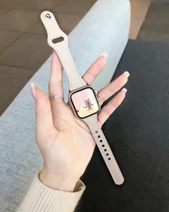 Beige leather strap compatible with Apple Watch, slim waist stylish design for women.