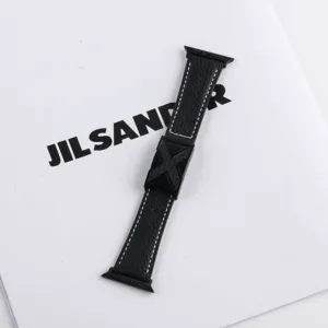 Black leather Apple Watch strap with X-shaped metal buckle, compatible with all series.