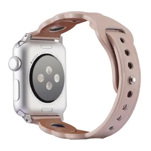 Pink leather scalloped replacement watch band detail showing fine stitching and metal button.