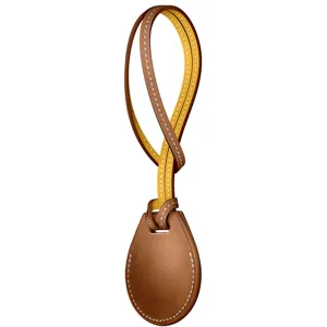 Leather case detail for Apple AirTag, premium brown key ring holder with contrast strap stitching.